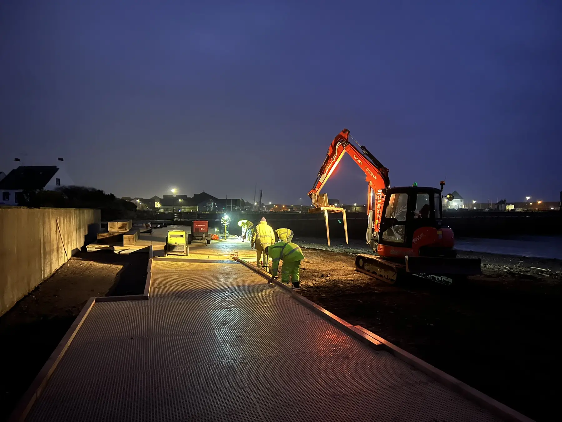 Cowran Estate Services delivering Maryport Boardwalk at night